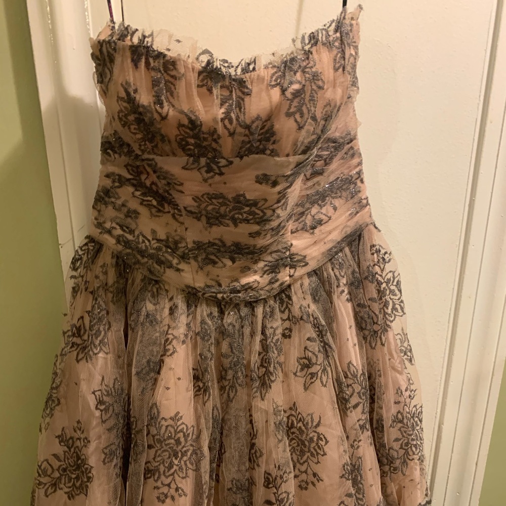 Pink strapless with black design. Brand new
